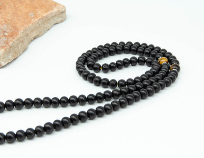 Schwarze Rosenholz Mala mit Tigerauge - 9mm